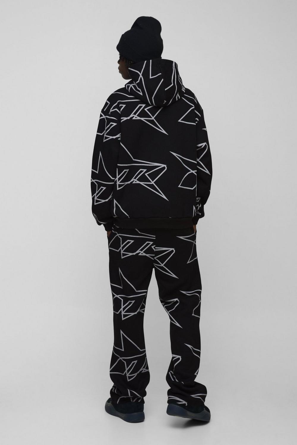 black-oversized-star-all-over-printed-gusset-flare-hooded-tracksuit-1.jpg